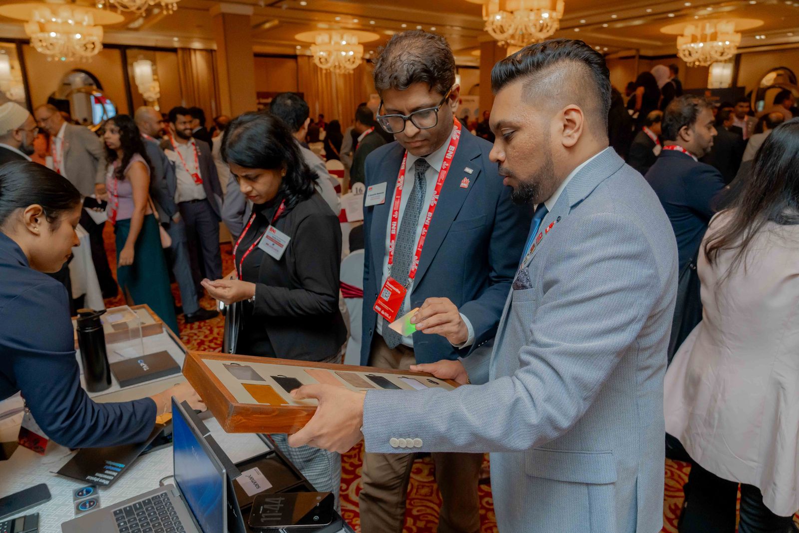 Members trying TapID cards and coins from the display tray